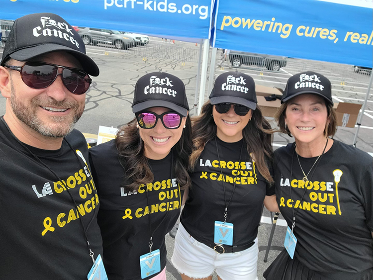 Picture of the PCRF team wearing Fuck Cancer hats.