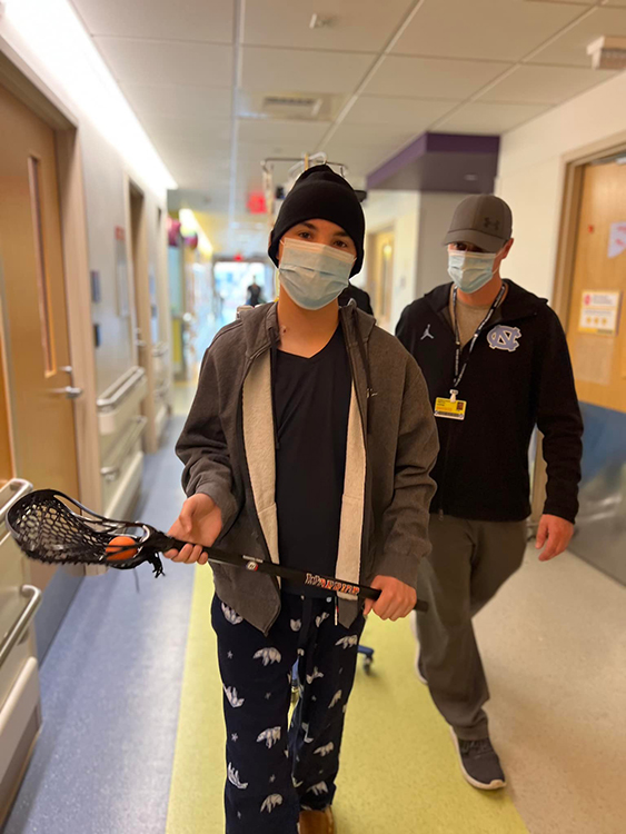 Nick holding his lacrosse stick.