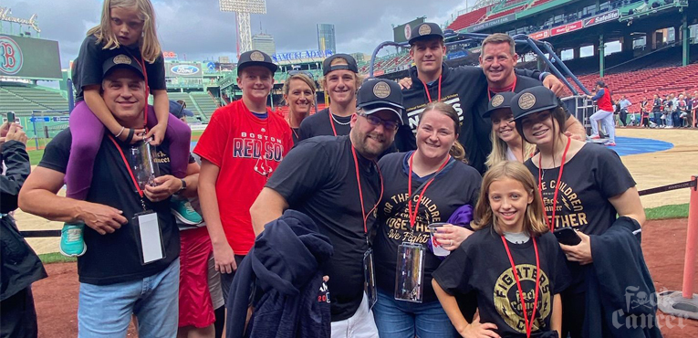 talon and family at the boston red sox baseball game